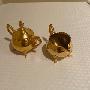 A sugar holder and saucer